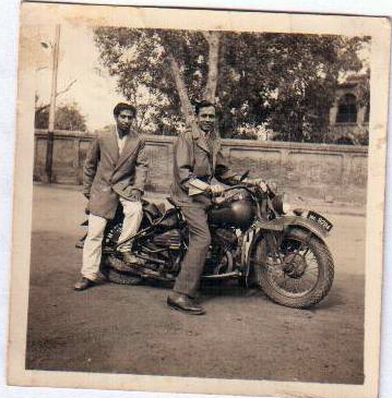 Flying Officer J. M. Massey on his Harley Davidson motorcycle with his orderly, Nazir. 1947 Flying Officer J. M. Massey on his Harley Davidson motorcycle with his orderly, Nazir. 1947