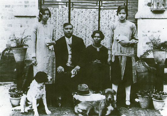 My maternal grandparents in Lahore in 1928. My mother is on the right with her pet bunny rabbit. On the left is her elder sister, Rosie.