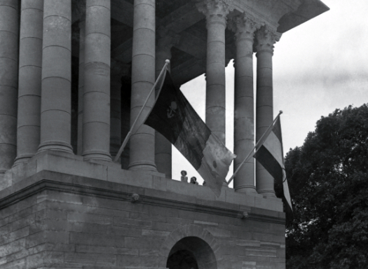 The colonnades of the Army Headquarters in South Block on the morning of 15-8-1947. The Indian Army's Standard and new India's national flag fly side by side. The latter had replaced the British Union Jack there a short while earlier. Indian Army and new national flaf on South Colonnade