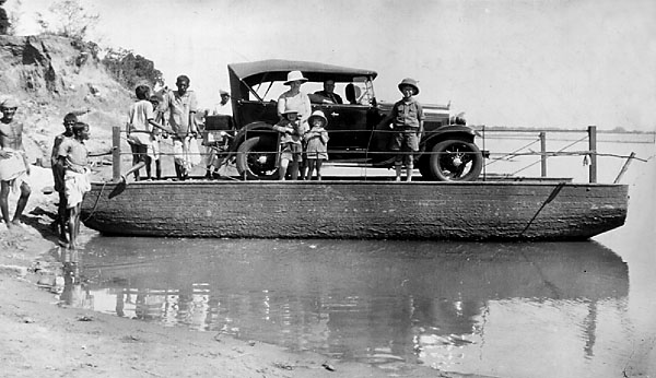 Subarnarekha River Car Ferry. Mother, Stanley, Frances, John outside, and Dad in the car. Around 1930. Subarnekha car ferrt