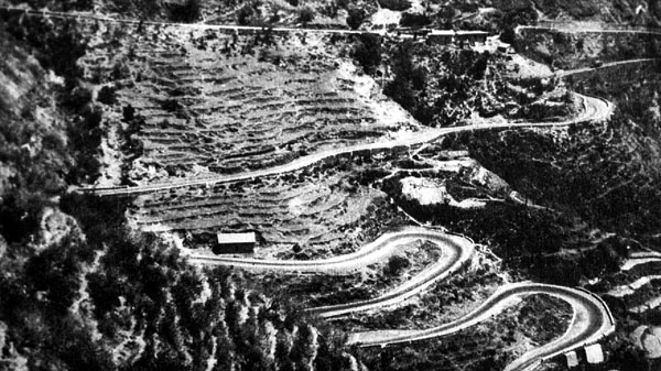 The Mussoorie motor road famous for its hairpin turns.1930s. Source: The Whispering Pine. Musoorie Motor Road 1930s